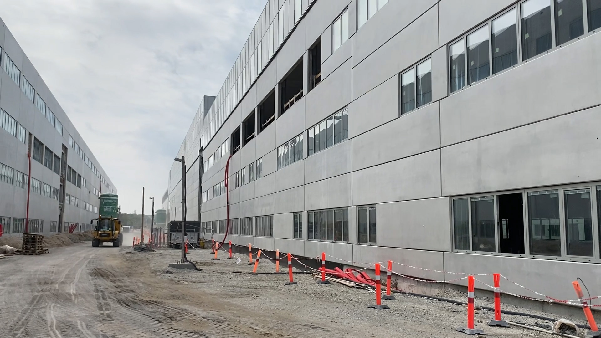 A dumper driving alongside the new OUH's buildings.